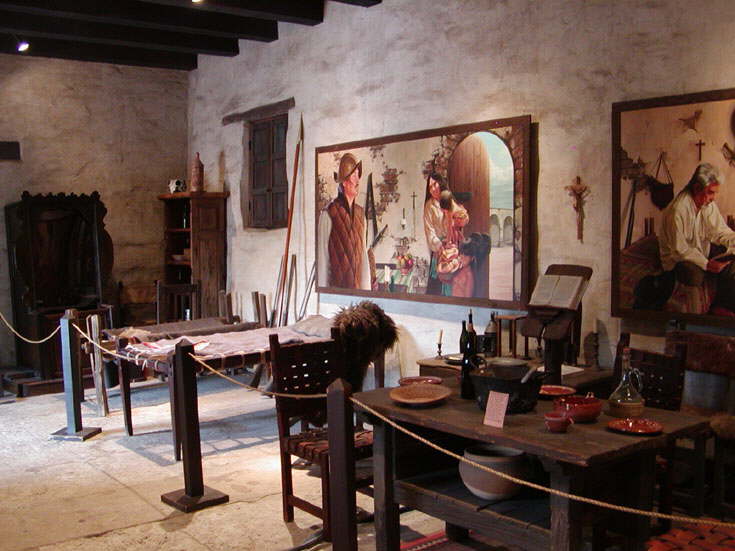 Museum display in rooms off arched walkways